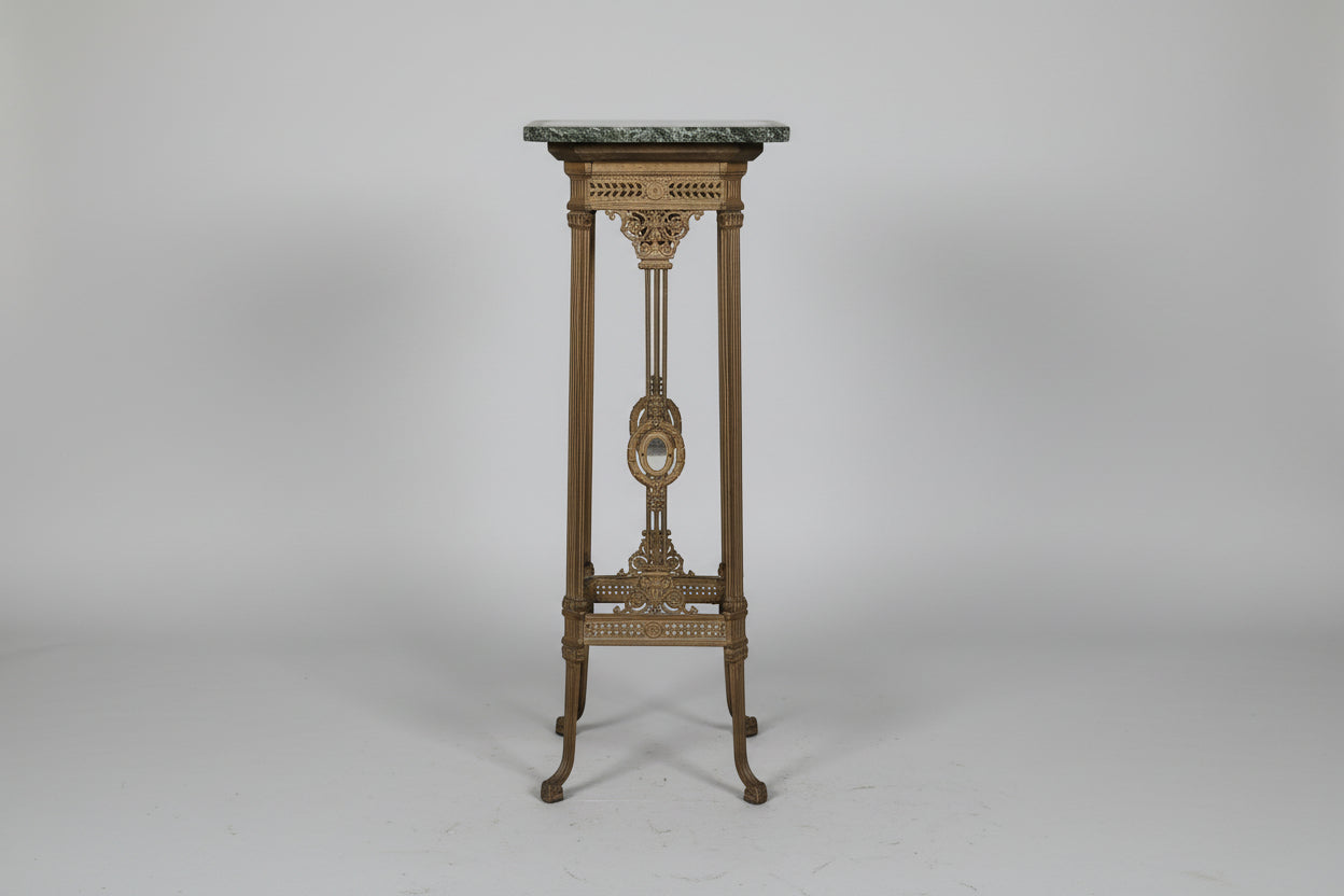 Decorative pedestal with marble top on a gray background