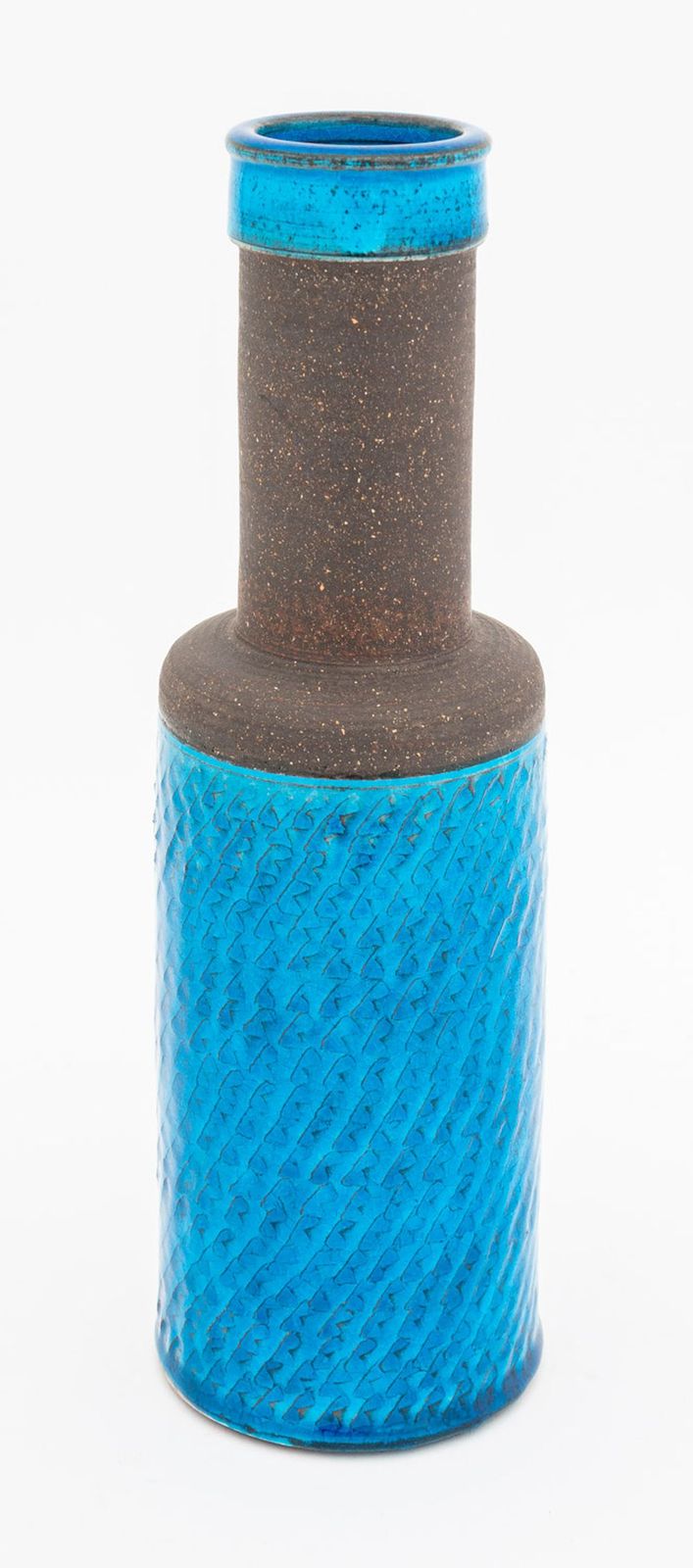 Cylindrical ceramic vase with textured blue and brown design on a white background