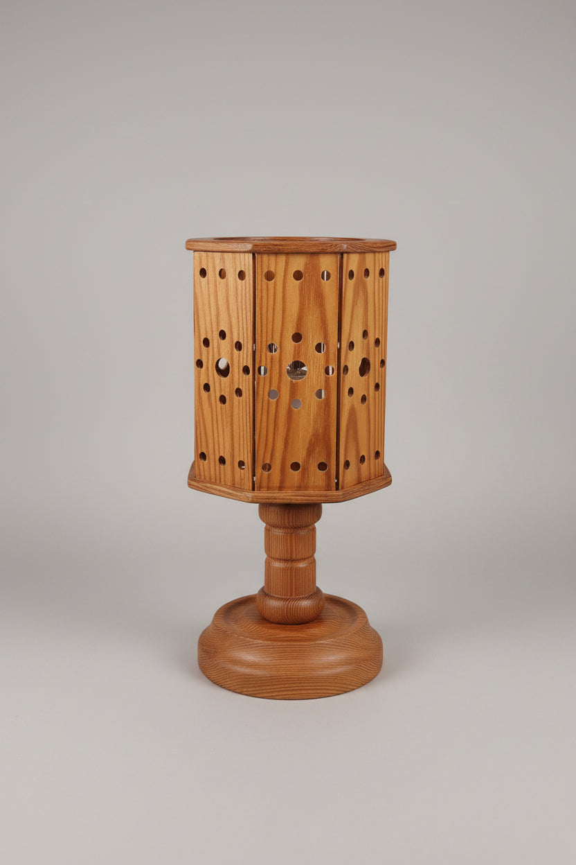 Wooden lamp with hexagonal design on a white surface