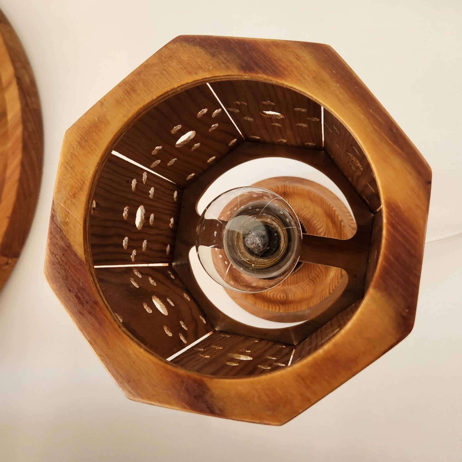 birds-eye view of small wooden table lamp with light bulb
